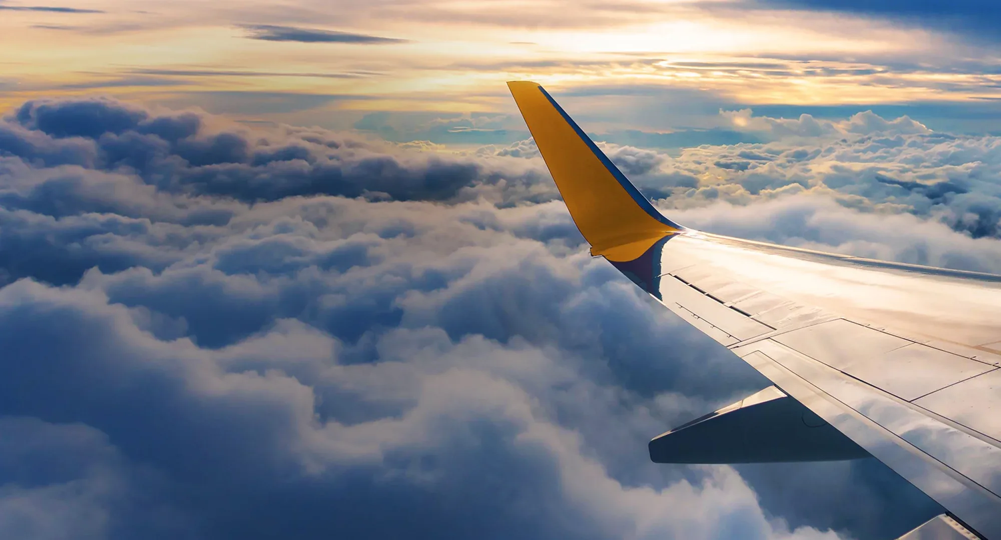 Airplane Wing above the clouds