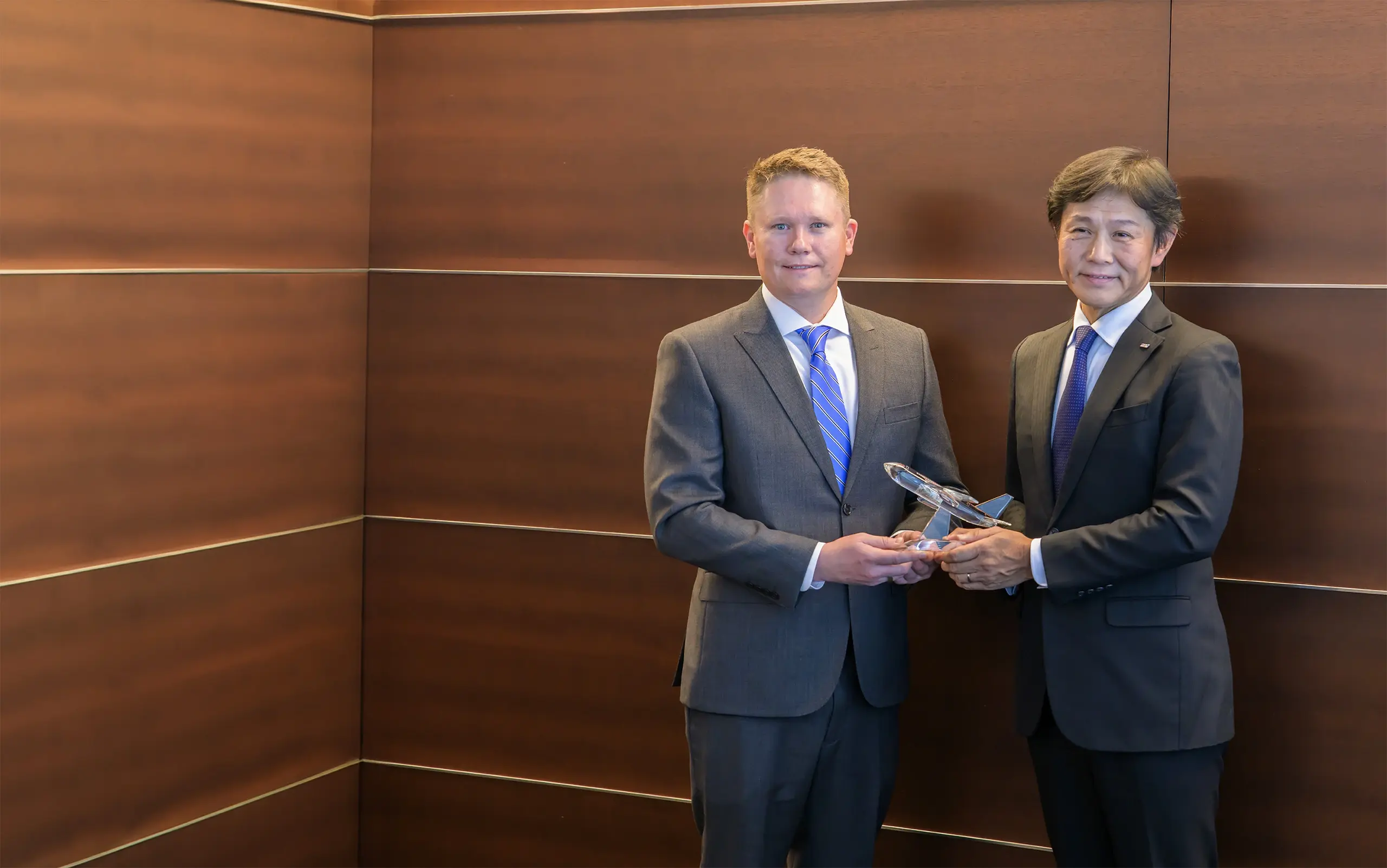 Michael Avery, President and General Manager of 1PointFive and Shinichi Inoue, President and CEO of ANA holding a ceremonial glass airplane