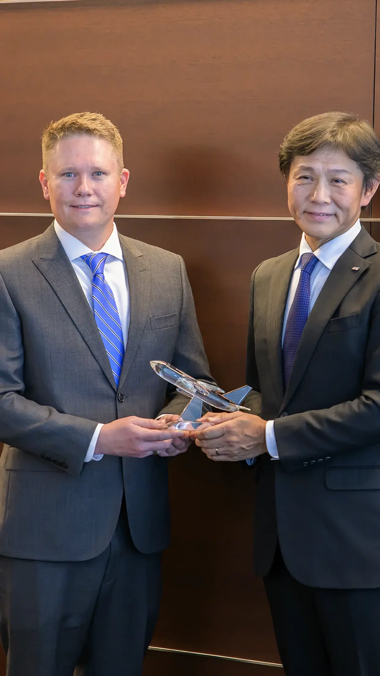 Michael Avery, President and General Manager of 1PointFive and Shinichi Inoue, President and CEO of ANA holding a ceremonial glass airplane